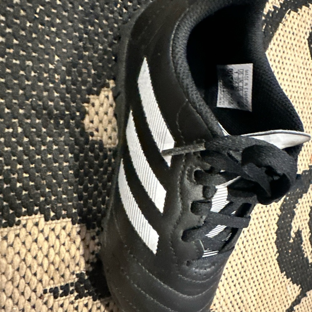 Boys adidas cleat used black and white